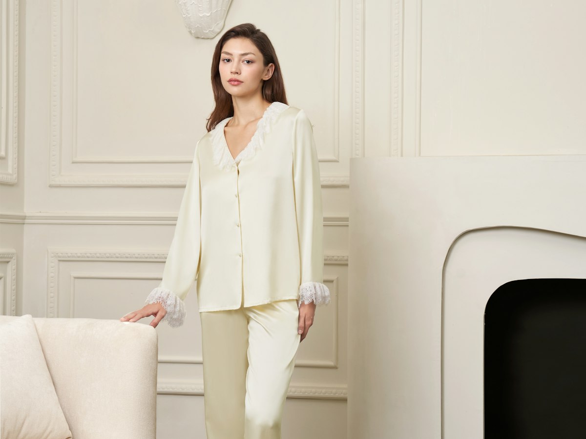Woman in cream silk pyjamas